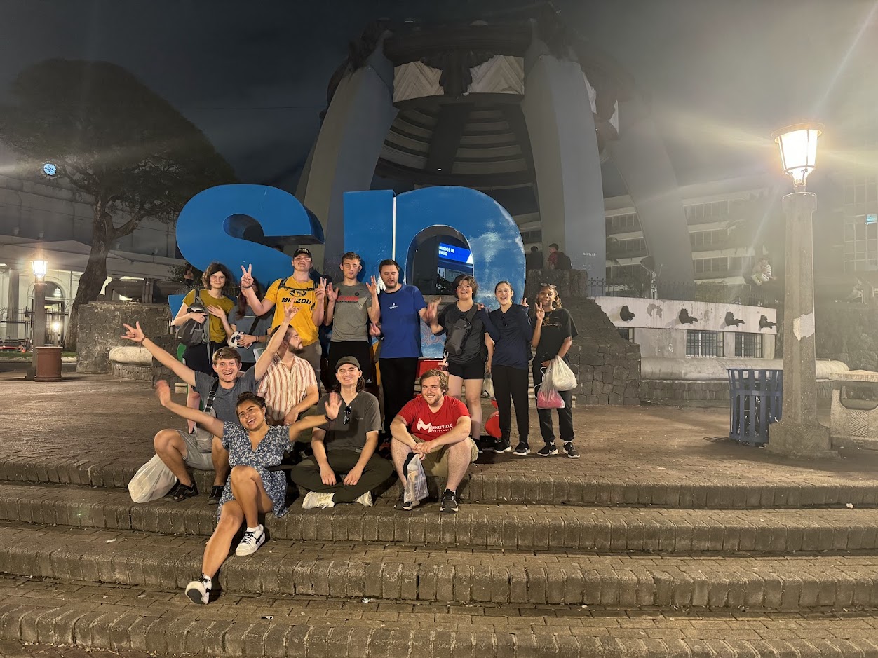 Group at San Jose sign